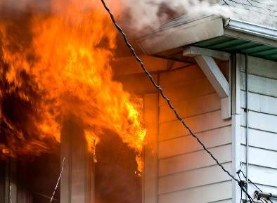 House with the roof on fire